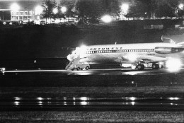 FILE -- A hijacked Northwest Airlines jetliner is seen in this Nov. 25, 1971 file photo as it sits on a runway for refueling at Seattle-Tacoma International Airport, Nov. 25, 1971, Seattle. 2011 has been a rich year for students of D.B. Cooper, the mysterious skyjacker who vanished out the back of the Boeing 727 wearing a business suit, a parachute and a pack with $200,000 in ransom money 40 years ago Thursday. (AP Photo, File)