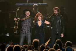 Kix Brooks, left, and Ronnie Dunn, right, of Brooks and Dunn, and Reba McEntire perform at the 49th annual CMA Awards at the Bridgestone Arena on Wednesday, Nov. 4, 2015, in Nashville, Tenn. (Photo by Chris Pizzello/Invision/AP)