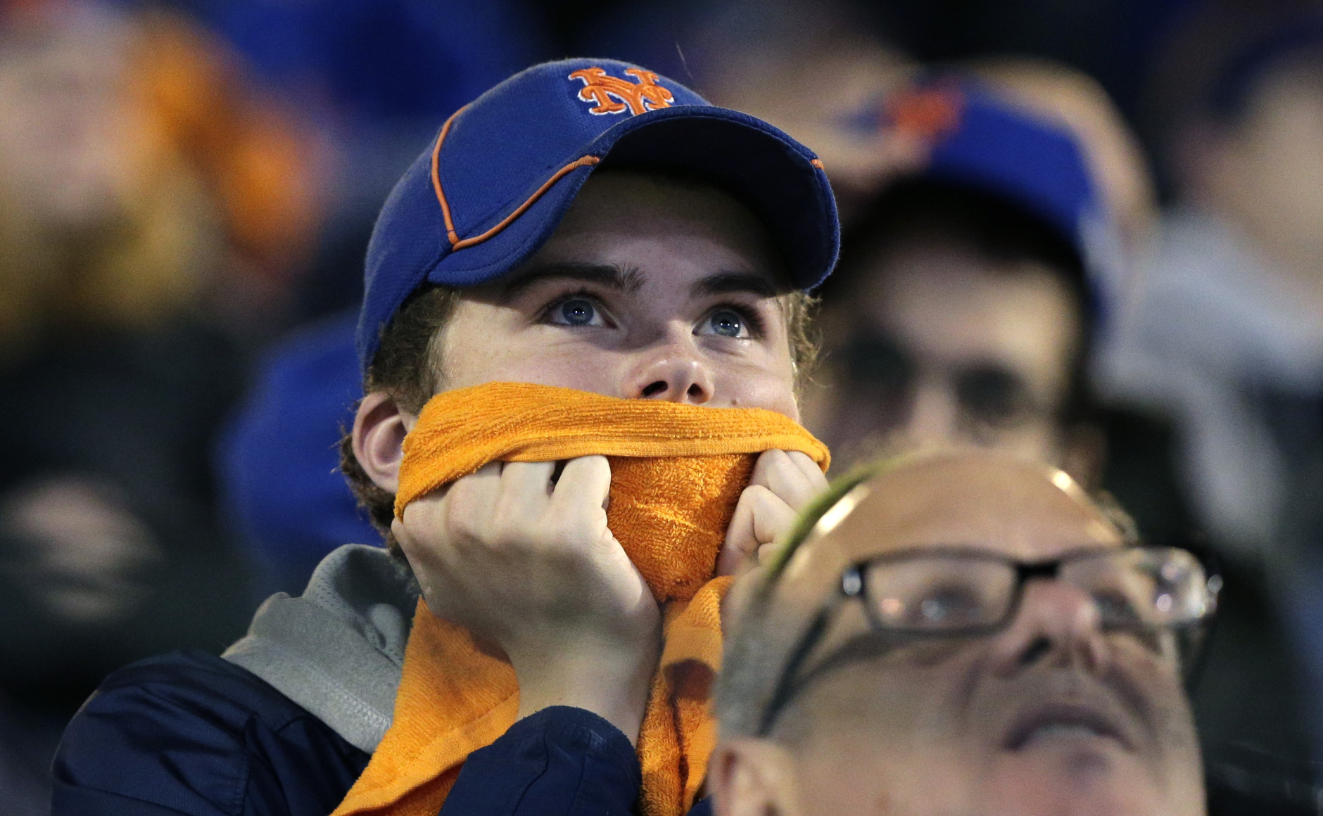 New York Mets fans watch during the 12th inning of Game 5 of the Major League Baseball World Series against the Kansas City Royals Monday, Nov. 2, 2015, in New York. (AP Photo/Peter Morgan)