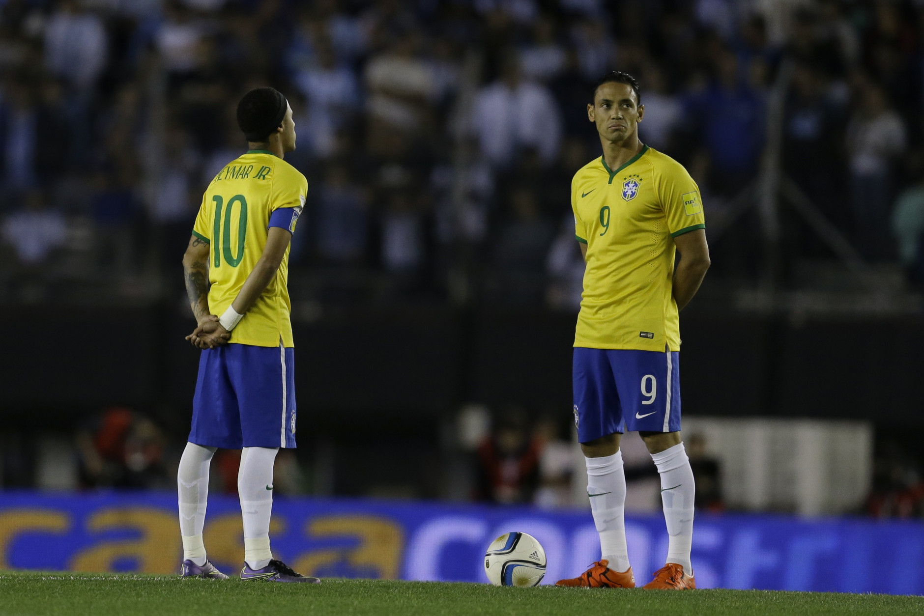 Brazil's Neymar, left, and Ricardo Oliveira observe a minutes of silence to pay their respects to the victims of attack that took place in Paris prior to a 2018 World Cup qualifying soccer match in Buenos Aires, Argentina, Friday, Nov. 13, 2015. Several dozen people were killed in attacks around Paris on Friday, French President Francois Hollande said, announcing that he was closing the countrys borders and declaring a state of emergency. (AP Photo/Victor R. Caivano)