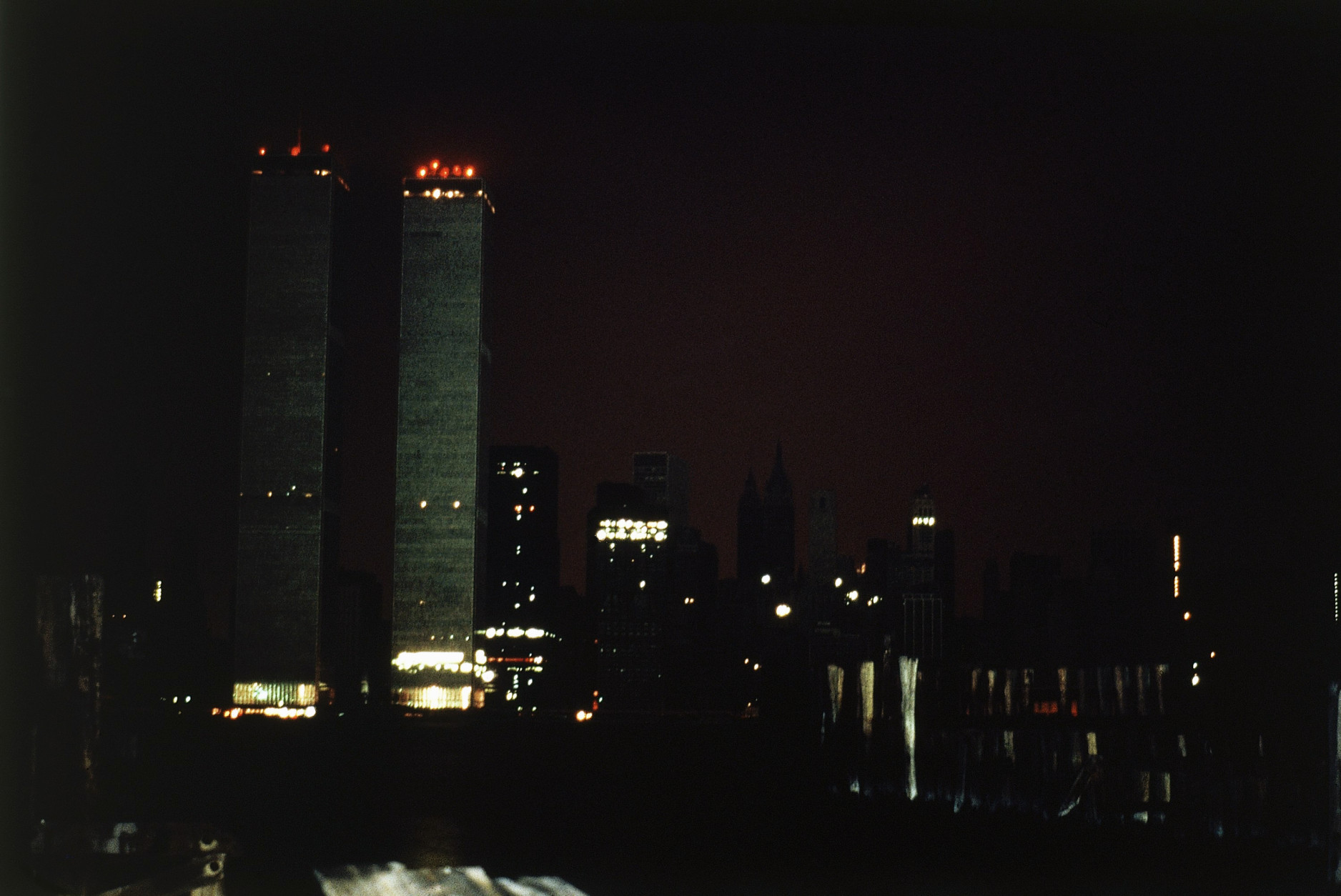 The twin towers of the World Trade Center and the southern tip of Manhattan are plunged into near darkness as a massive power failure hits New York City and surrounding suburbs, July 13, 1977. The power failure was attributed to lightning which hit several upstate transmission cables. In contrast to the northeast's 1965 blackout, there was severe looting in parts of the affected region. (AP Photo/Dave Pickoff)