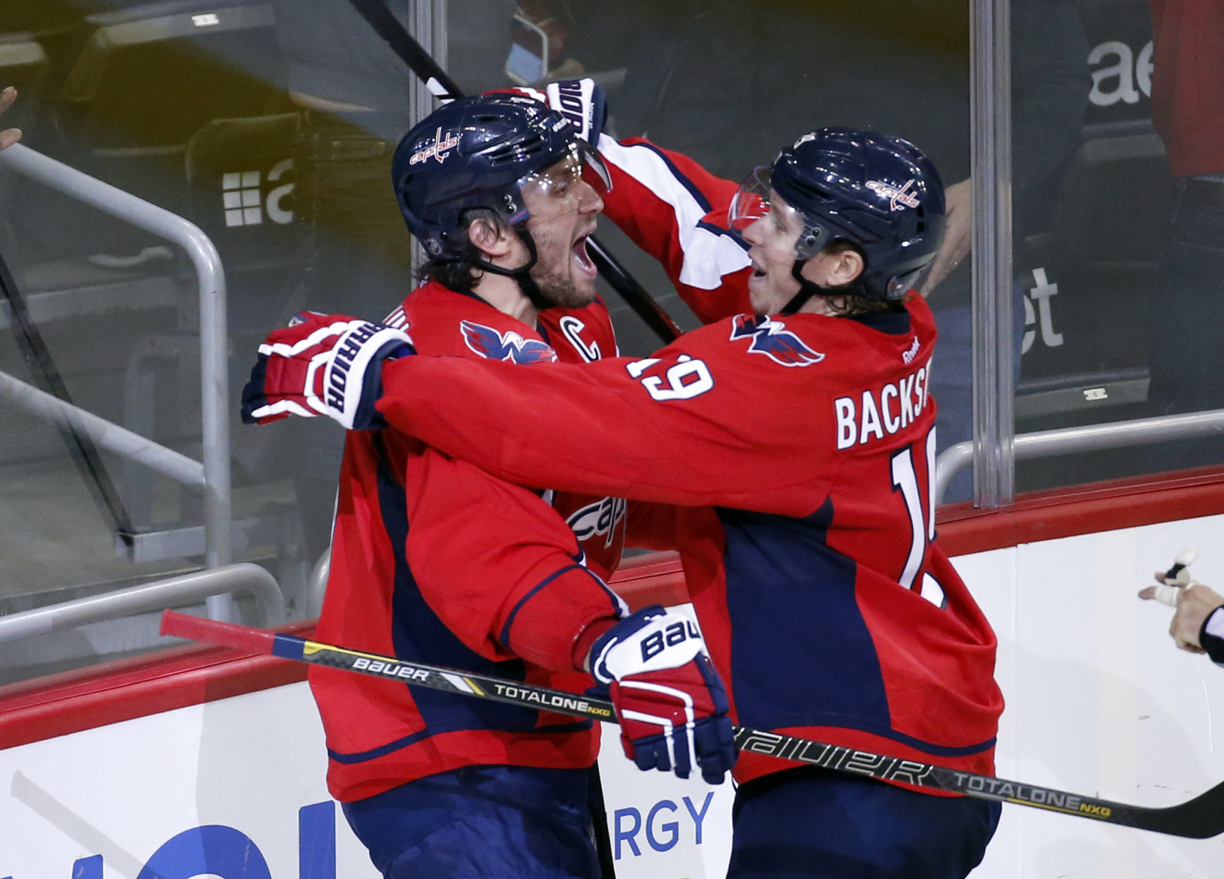 Washington Capitals left wing Alex Ovechkin, left, from Russia, celebrates his goal with center Nicklas Backstrom (19), from Sweden, during the third period of an NHL hockey game against the Dallas Stars, Thursday, Nov. 19, 2015, in Washington. Ovechkin scored his 484th career NHL goal, breaking Sergei Fedorov's record for most by a Russian-born player. The Stars won 3-2. (AP Photo/Alex Brandon)