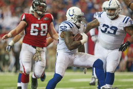 Indianapolis Colts inside linebacker D'Qwell Jackson (52) scores a touchdown against Atlanta Falcons after intercepting the ball during the second of an NFL football game, Sunday, Nov. 22, 2015, in Atlanta. (AP Photo/John Bazemore)