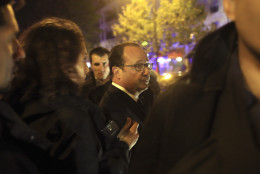 French President Francois Hollande arrives to visit the site of the the Bataclan theater after a shooting in Paris, Friday Nov. 13, 2015.  French President Francois Hollande declared a state of emergency and announced that he was closing the country's borders. Paris Prosecutor Francois Molins says the death toll in attacks at six sites around the French capital could exceed 120. (AP Photo/Thibault Camus)