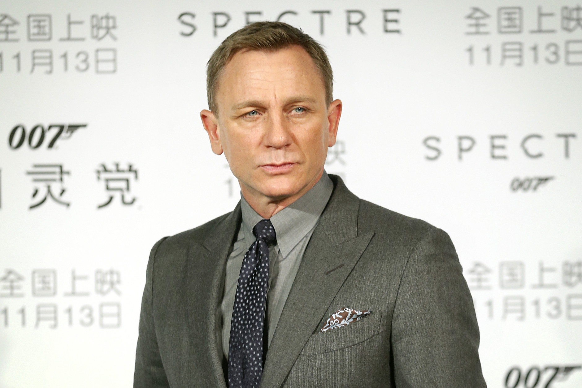 British actor Daniel Craig poses for photographers before a press conference for the movie "Spectre" in Beijing, Tuesday, Nov. 10, 2015. The film, the latest in the James Bond franchise, opens in China on Friday. (AP Photo/Mark Schiefelbein)