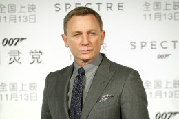British actor Daniel Craig poses for photographers before a press conference for the movie "Spectre" in Beijing, Tuesday, Nov. 10, 2015. The film, the latest in the James Bond franchise, opens in China on Friday. (AP Photo/Mark Schiefelbein)