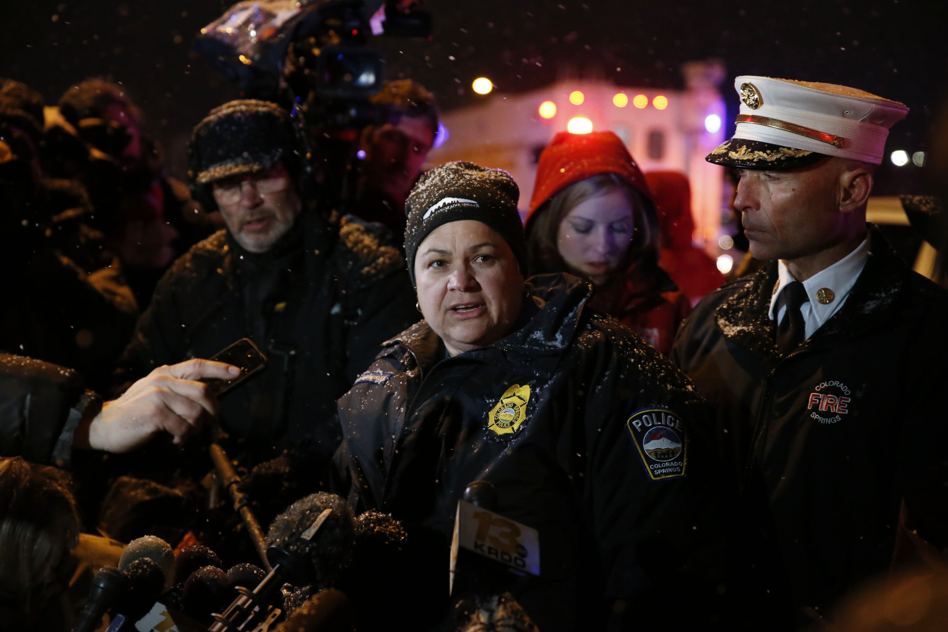 Lt. Catherine Buckley, center, of the Colorado Springs Police Department, talk to members of the media as Fire Chief Christopher Riley, right, looks on after a shooting at a Planned Parenthood clinic Friday, Nov. 27, 2015, in Colorado Springs, Colo. (AP Photo/David Zalubowski)