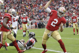 San Francisco 49ers quarterback Blaine Gabbert (2) spikes the ball after running to the 1-yard line against the Atlanta Falcons during the first half of an NFL football game in Santa Clara, Calif., Sunday, Nov. 8, 2015. The 49ers won 17-16. (AP Photo/Marcio Jose Sanchez)