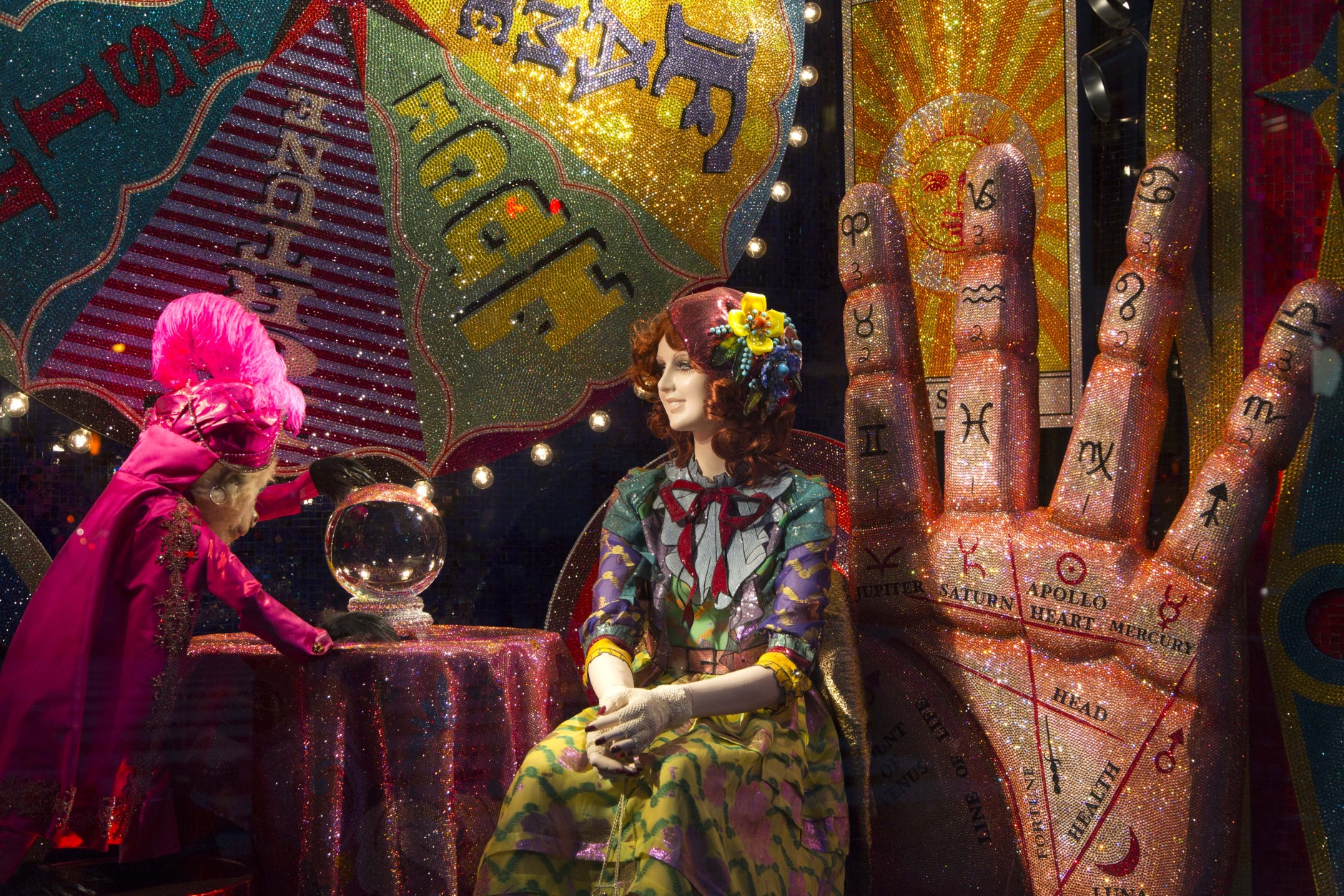 A fortune teller display appears in a holiday window at Bergdorf Goodman, Tuesday, Nov. 24, 2015 in New York. Many New York stores participate in the seasonal ritual of window display pageantry. (AP Photo/Mark Lennihan)