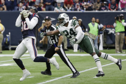 Houston Texans wide receiver DeAndre Hopkins (10) pulls in a pass for a touchdown as he is defended by New York Jets cornerback Darrelle Revis (24) during the first half of an NFL football game, Sunday, Nov. 22, 2015, in Houston. (AP Photo/David J. Phillip)