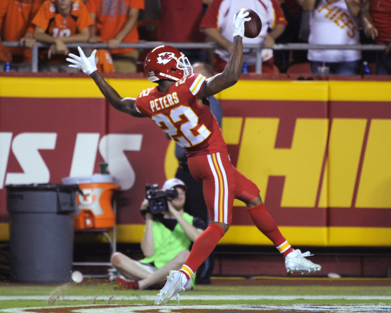 Kansas City Chiefs defensive back Marcus Peters (22) celebrates his interception of a pass by Denver Broncos quarterback Peyton Manning for a touchdown during the first half of an NFL football game in Kansas City, Mo., Thursday, Sept. 17, 2015. (AP Photo/Ed Zurga)