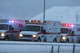 Ambulances wait to be directed near intersection of Centennial and Fillmore near a Planned Parenthood clinic Friday, Nov. 27, 2015, in Colorado Springs, Colo. A gunman opened fire at the clinic on Friday, authorities said, wounding multiple people. (AP Photo/David Zalubowski)