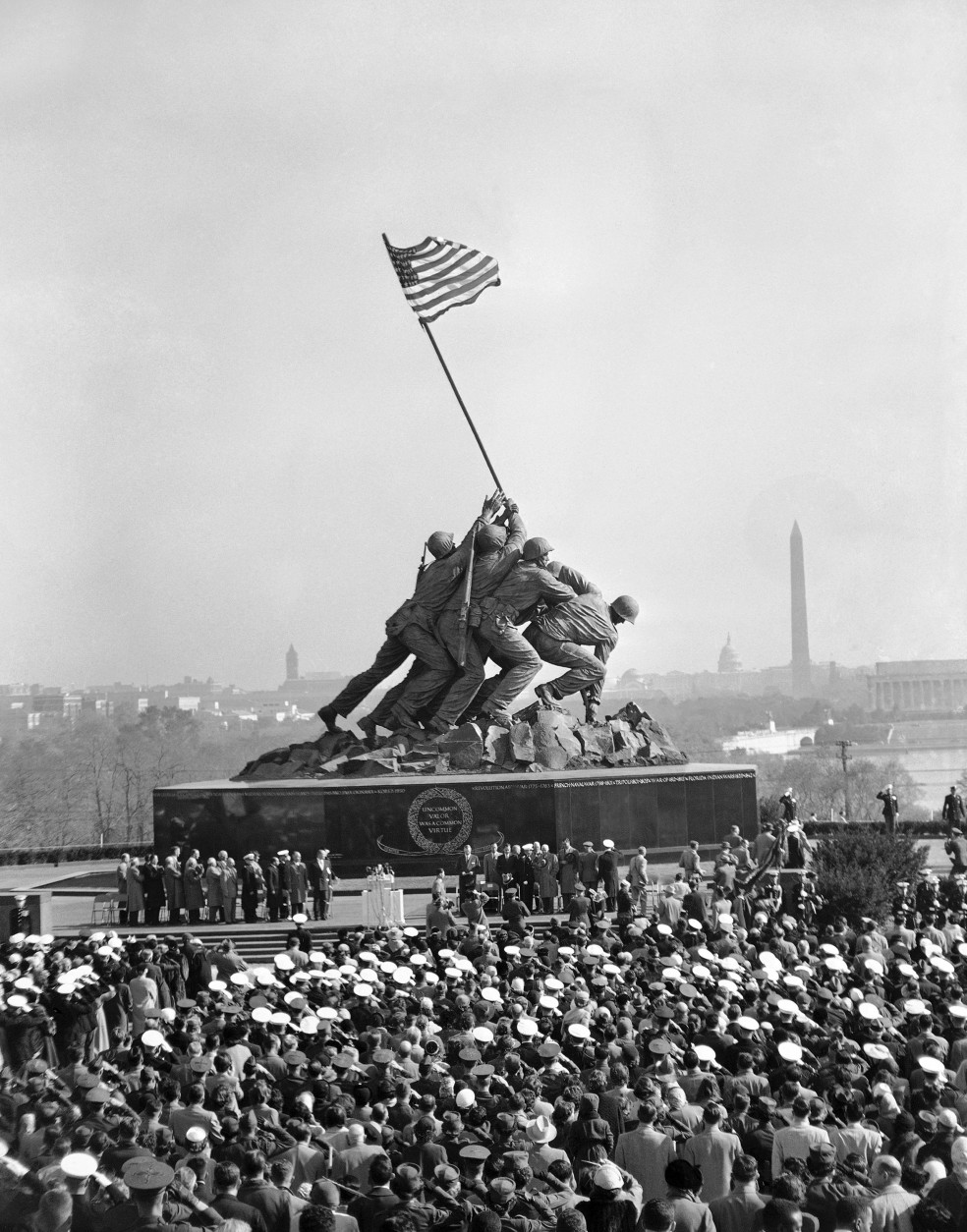 Historic flag rising on Iwo Jima is dedicated across the river from Washington on Nov. 10, 1954, in honor of the U.S. Marine Corps. President Dwight Eisenhower and other dignitaries are on platform just below the 75-foot statue. (AP Photo/Charles P. Gorry)
