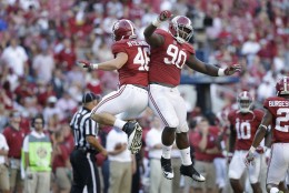 Alabama Crimson defensive lineman Jarran Reed (90) and Alabama Crimson tight end Michael Nysewander (46) celebrate after a tackle during the second half of an NCAA college football game, Saturday, Sept. 12, 2015, in Tuscaloosa, Ala. Alabama won 37-10. (AP Photo/Brynn Anderson)