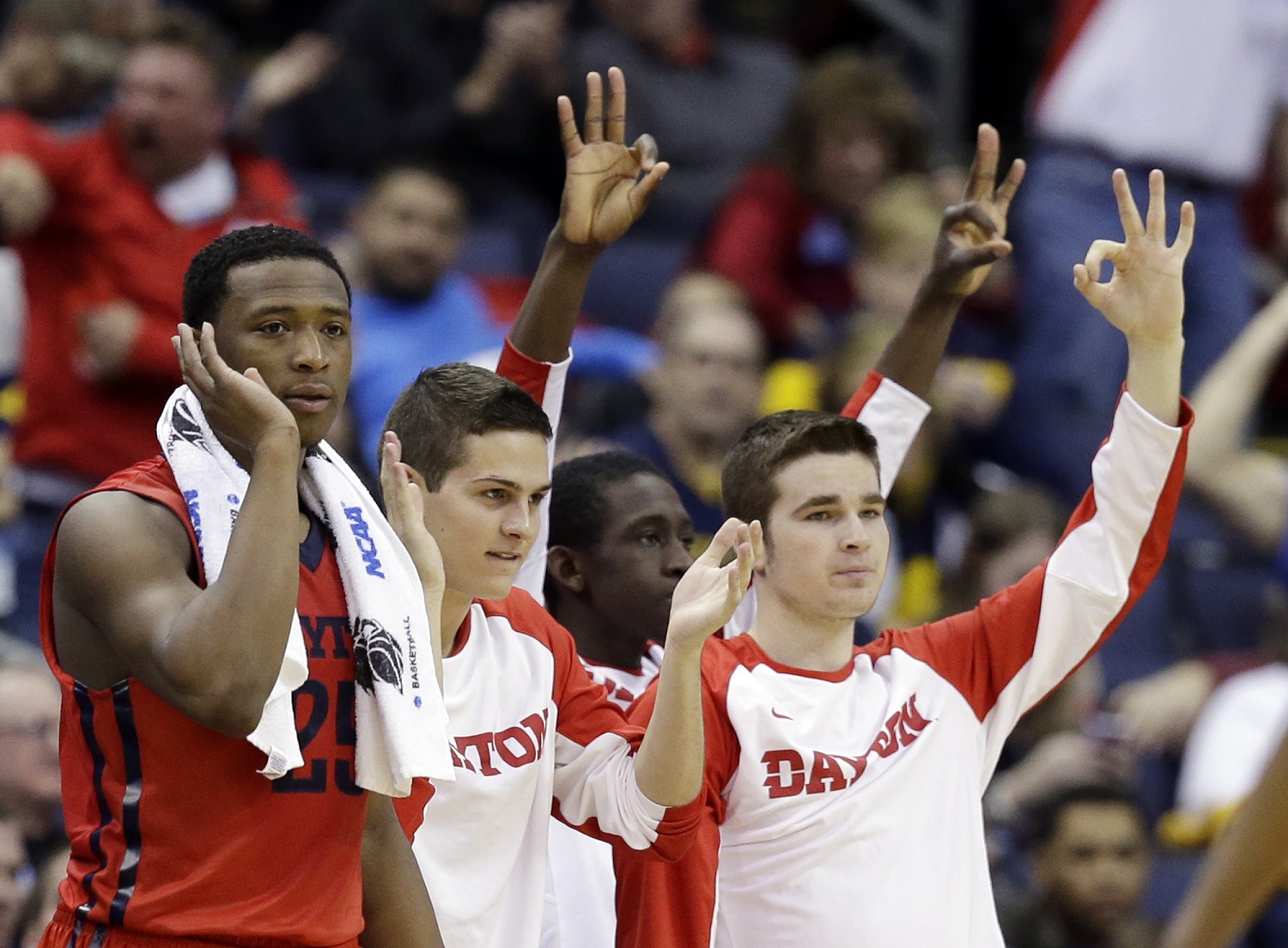 The Dayton bench celebrates a 3-point basket in the first half of an NCAA tournament college basketball game against Oklahoma in the Round of 32 in Columbus, Ohio, Sunday, March 22, 2015. (AP Photo/Tony Dejak)