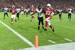 GLENDALE, AZ - OCTOBER 26:  Running back Chris Johnson #23 of the Arizona Cardinals runs in a 26 yard touchdown against linebacker C.J. Mosley #57 of the Baltimore Ravens in the first quarter of the NFL game at University of Phoenix Stadium on October 26, 2015 in Glendale, Arizona.  (Photo by Norm Hall/Getty Images)