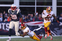 FOXBORO, MA - NOVEMBER 8: LeGarrette Blount #29 of the New England Patriots runs by Dashon Goldson #38 and Jeron Johnson #20 of the Washington Redskins in the second half at Gillette Stadium on November 8, 2015 in Foxboro, Massachusetts. (Photo by Jim Rogash/Getty Images)