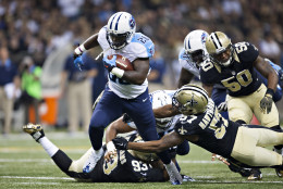 NEW ORLEANS, LA - NOVEMBER 8:  Antonio Andrews #26 of the Tennessee Titans runs the ball and is hit by David Hawthorne #57 of the New Orleans Saints at Mercedes-Benz Superdome on November 8, 2015 in New Orleans, Louisiana.  The Titans defeated the Saints in overtime 34-28.  (Photo by Wesley Hitt/Getty Images)