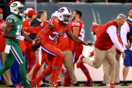 EAST RUTHERFORD, NJ - NOVEMBER 12:  Bacarri Rambo #30 of the Buffalo Bills celebrates after he intercepted the ball in the final minute of the game as Kenbrell Thompkins #10 of the New York Jets walks off the field on November 12, 2015 at MetLife Stadium in East Rutherford, New Jersey.The Buffalo Bills defeated the New York Jets 22-17.Buffalo Bills head coach Rex Ryan celebrates on the sideline.  (Photo by Elsa/Getty Images)