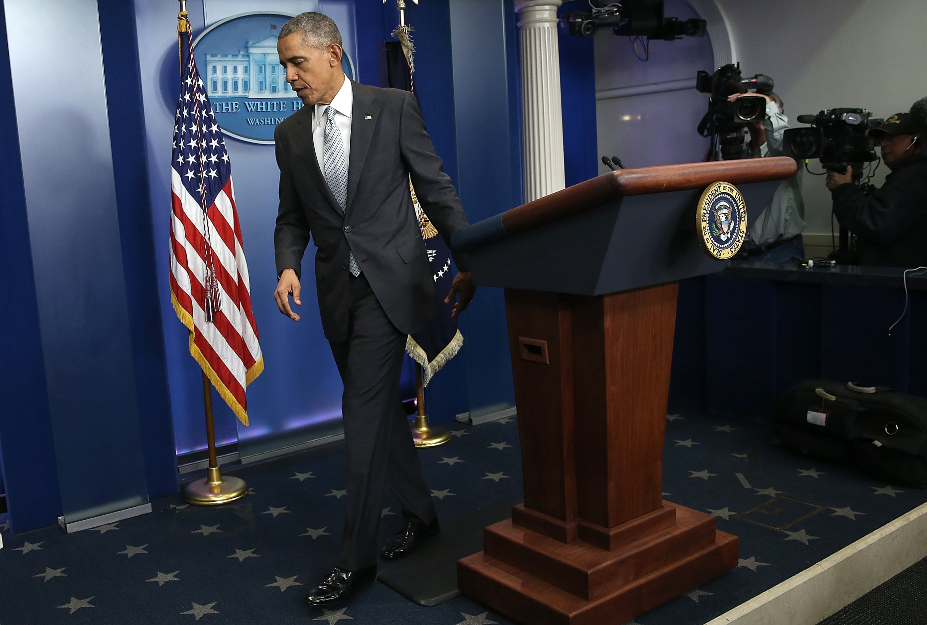 WASHINGTON, DC - NOVEMBER 13:  U.S. President Barack Obama departs the White House briefing room after delivering remarks on the recent violence taking place in Paris, France November 13, 2015 in Washington, DC. Gunfire and explosions erupted in the French capital with early casualty reports indicating at least 60 dead.  (Photo by Win McNamee/Getty Images)