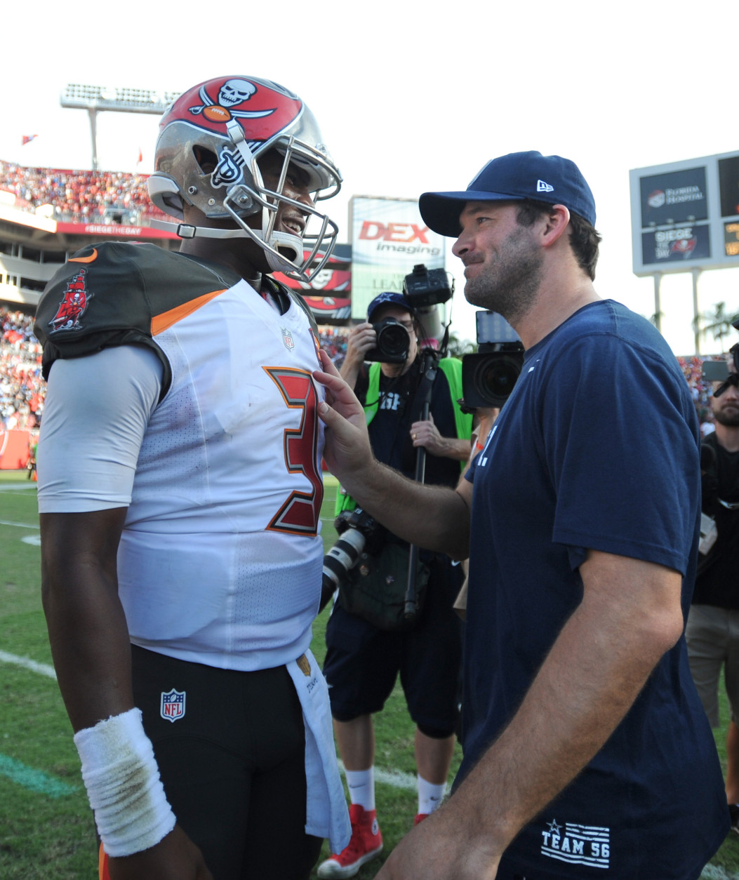 TAMPA, FL - NOVEMBER 15: Quarterback Jameis Winston #3 of the Tampa Bay Buccaneers talks with quarterback Tony Romo #9 of the Dallas Cowboys at the end of the game at Raymond James Stadium on November 15, 2015 in Tampa, Florida. The Buccaneers beat the Cowboys 10-6. (Photo by Cliff McBride/Getty Images) *** Local Caption *** Jameis Winston;Tony Romo