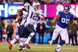 EAST RUTHERFORD, NJ - NOVEMBER 15:  Tom Brady #12 of the New England Patriots scrambles out of the pocket against the New York Giants during the first quarter at MetLife Stadium on November 15, 2015 in East Rutherford, New Jersey.  (Photo by Elsa/Getty Images)