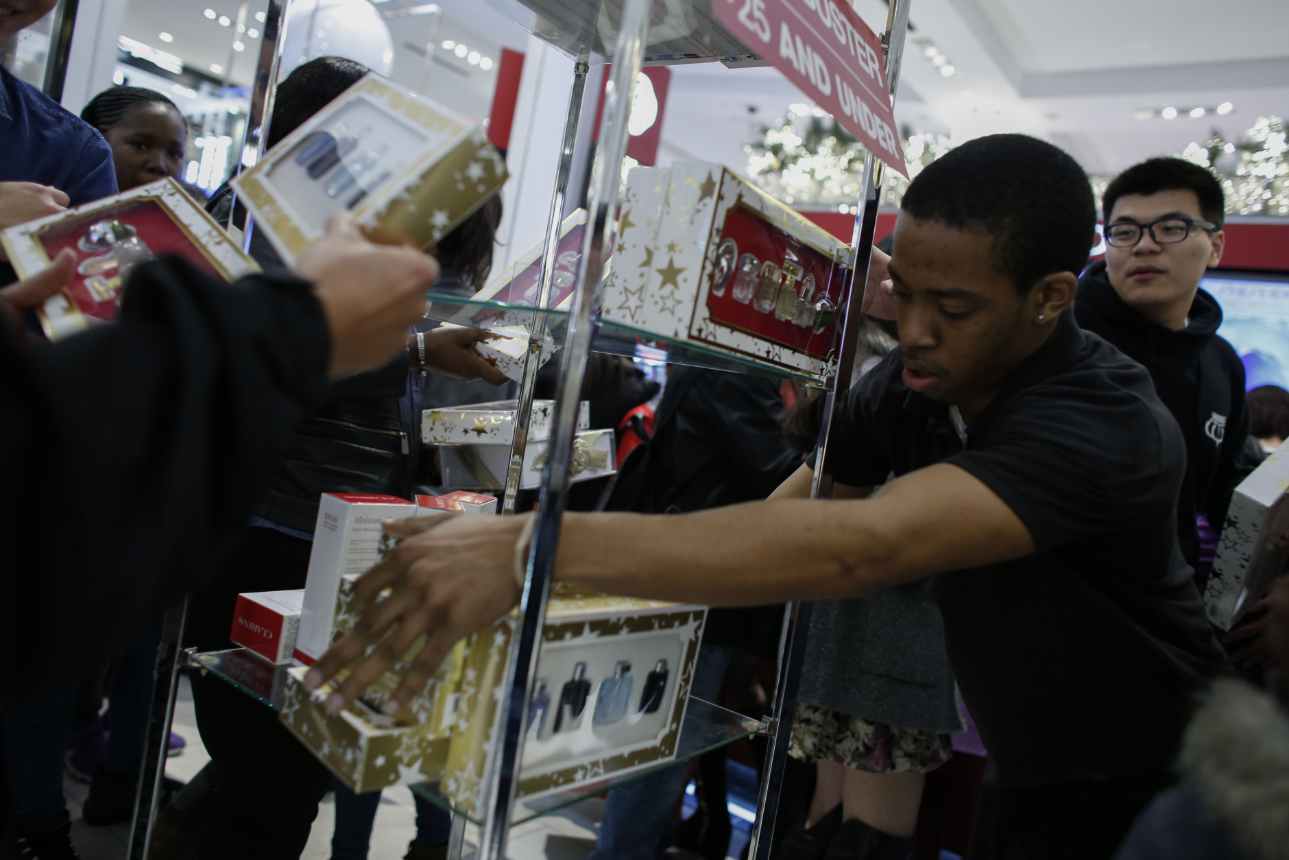 NEW YORK, NY - NOVEMBER 26: An employee restocks a shelf in Macy's flagship store in Herald Square on Thanksgiving evening for early Black Friday sales on November 26, 2015 in New York City. Security has been heightened in Herald Square and around the city as thousands of shoppers flock to stores for sales on the kickoff to the Christmas shopping season. (Photo by Kena Betancur/Getty Images)