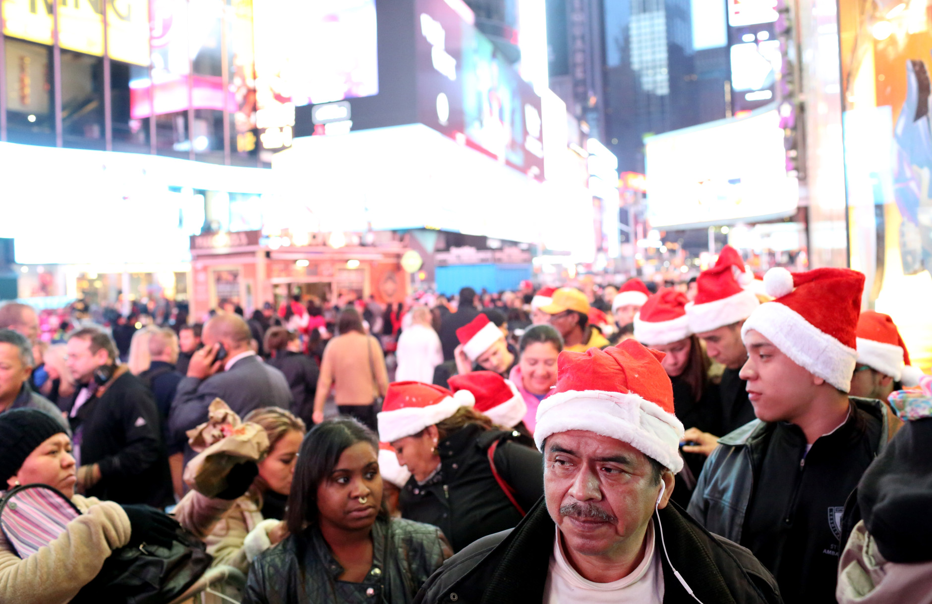 NEW YORK - NOVEMBER 26: Customers wait in line to enter Toys R Us in Times Square on Thanksgiving evening for early Black Friday sales on November 26, 2015 in New York City. Security has been heightened in Times Square and around the city as thousands of shoppers flock to stores for sales on the kickoff to the Christmas shopping season. (Photo by Yana Paskova/Getty Images)