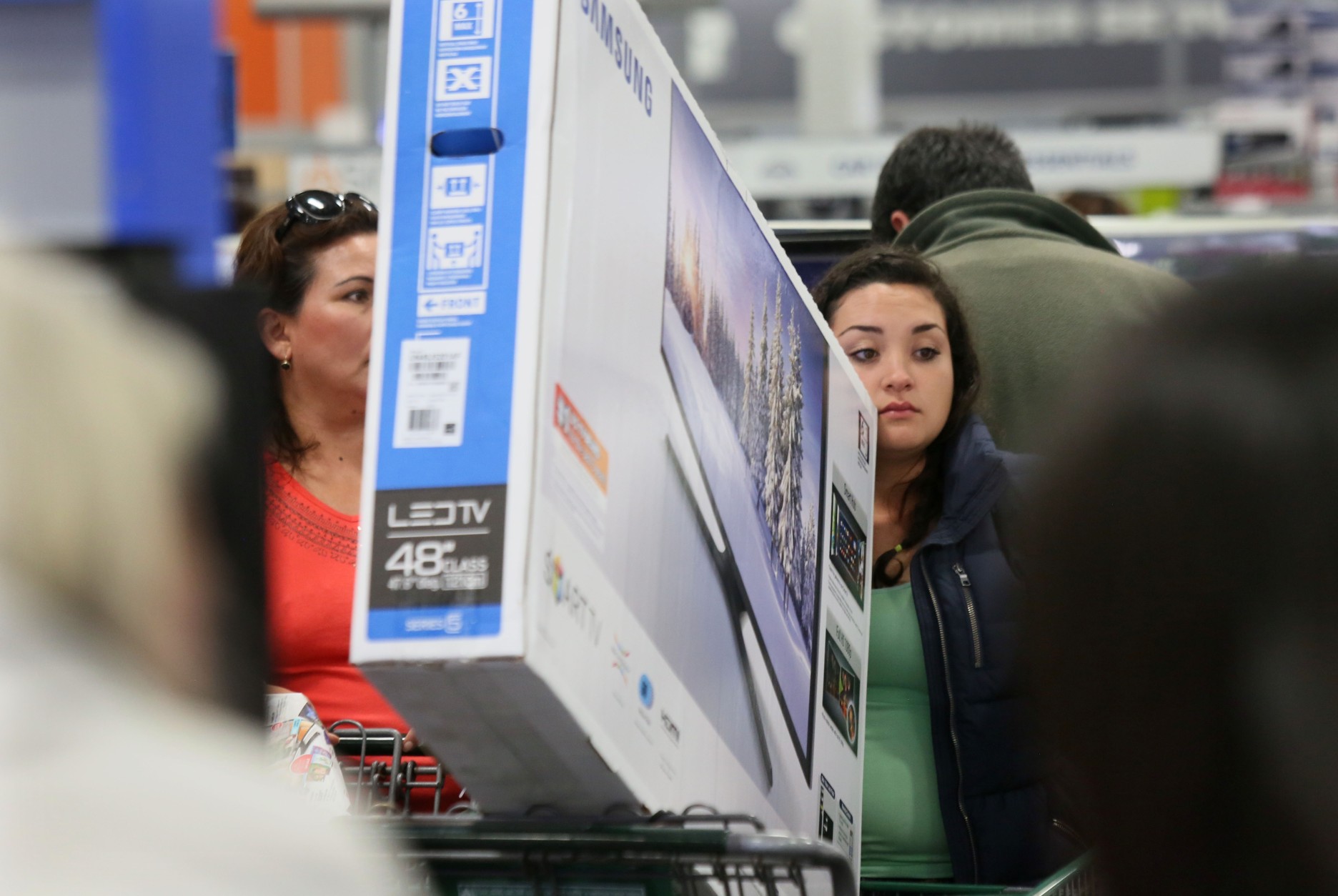 SAN DIEGO, CA - NOVEMBER 26:  Shoppers purchase electronics and other items at a Best Buy on November 26, 2015 in San Diego, California.  Although Black Friday sales are expected to be strong, many shoppers are opting to buy online or retailers are offering year round sales and other incentives that are expected to ease crowds. (Photo by Sandy Huffaker/Getty Images)