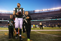 EAST RUTHERFORD, NJ - NOVEMBER 29:  Ryan Fitzpatrick #14 of the New York Jets walks off the field with his children after their 38-20 win against the Miami Dolphin at MetLife Stadium on November 29, 2015 in East Rutherford, New Jersey.  (Photo by Al Bello/Getty Images)