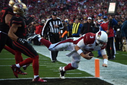 SANTA CLARA, CA - NOVEMBER 29:  Carson Palmer #3 of the Arizona Cardinals dives into the end zone for a seven-yard rushing touchdown against the San Francisco 49ers during their NFL game at Levi's Stadium on November 29, 2015 in Santa Clara, California.  (Photo by Thearon W. Henderson/Getty Images)