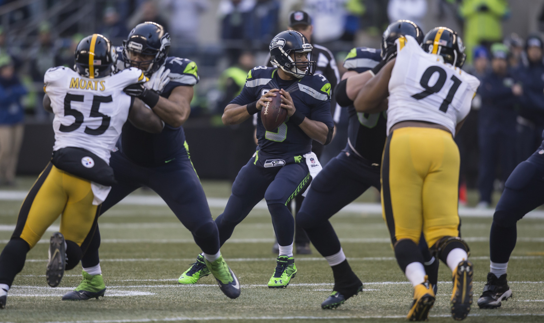 SEATTLE, WA - NOVEMBER 29: Quarterback Russell Wilson #3 of the Seattle Seahawks drops back to pass during the second half of a football game against the Pittsburgh Steelers at CenturyLink Field on November 29, 2015 in Seattle, Washington. The Seahawks won the game 39-30. (Photo by Stephen Brashear/Getty Images)