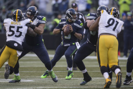 SEATTLE, WA - NOVEMBER 29: Quarterback Russell Wilson #3 of the Seattle Seahawks drops back to pass during the second half of a football game against the Pittsburgh Steelers at CenturyLink Field on November 29, 2015 in Seattle, Washington. The Seahawks won the game 39-30. (Photo by Stephen Brashear/Getty Images)