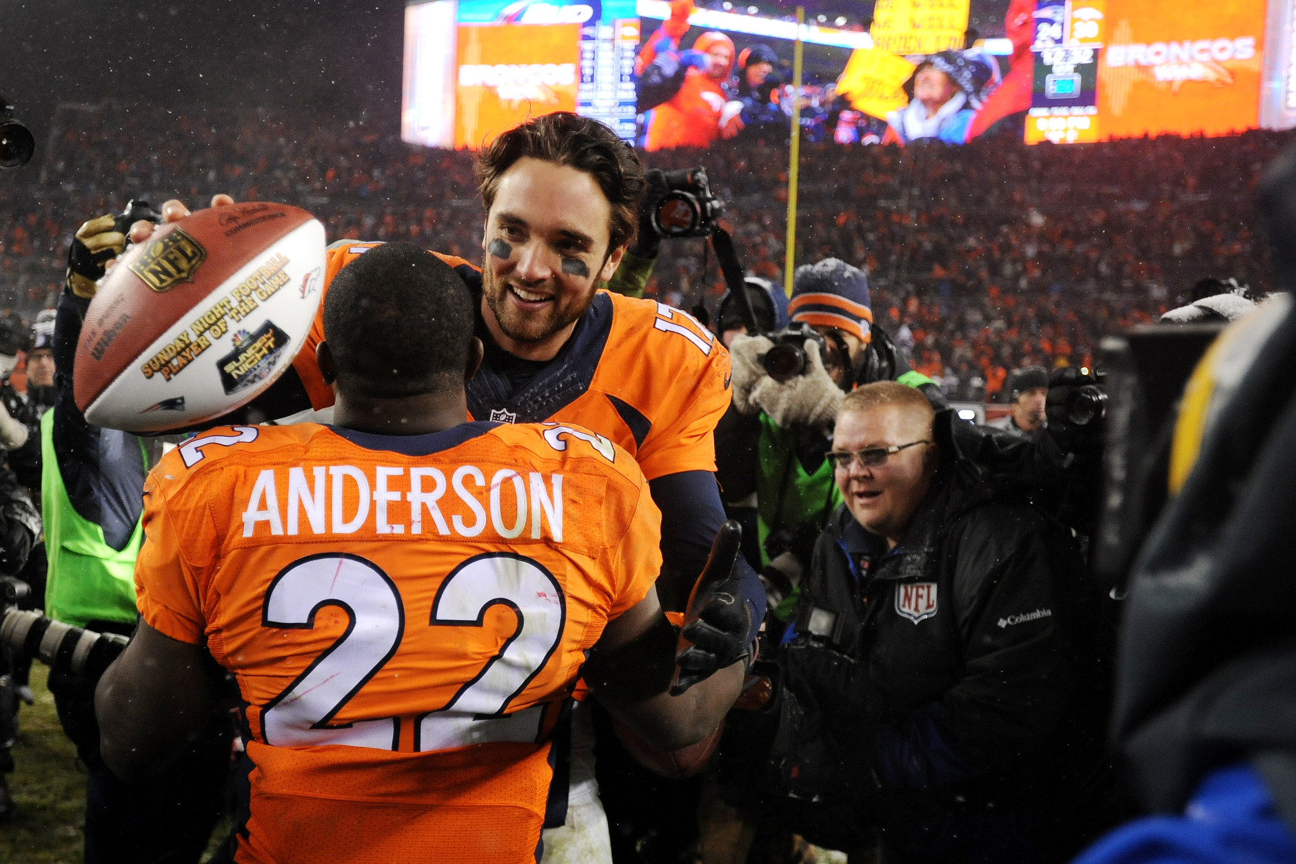 DENVER, CO - NOVEMBER 29: Quarterback Brock Osweiler #17 of the Denver Broncos celebrates with running back C.J. Anderson #22 of the Denver Broncos after defeating the New England Patriots 30-24 in overtime at Sports Authority Field at Mile High on November 29, 2015 in Denver, Colorado. (Photo by Dustin Bradford/Getty Images)