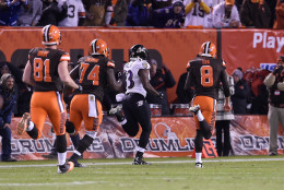 CLEVELAND, OH - NOVEMBER 30:  Will Hill #33 of the Baltimore Ravens returns a blocked field goal for a touchdown in front of Jim Dray #81, Cameron Erving #74 and Andy Lee #8 of the Cleveland Browns during the fourth quarter at FirstEnergy Stadium on November 30, 2015 in Cleveland, Ohio. Baltimore won the game 33-27.  (Photo by Jason Miller/Getty Images)