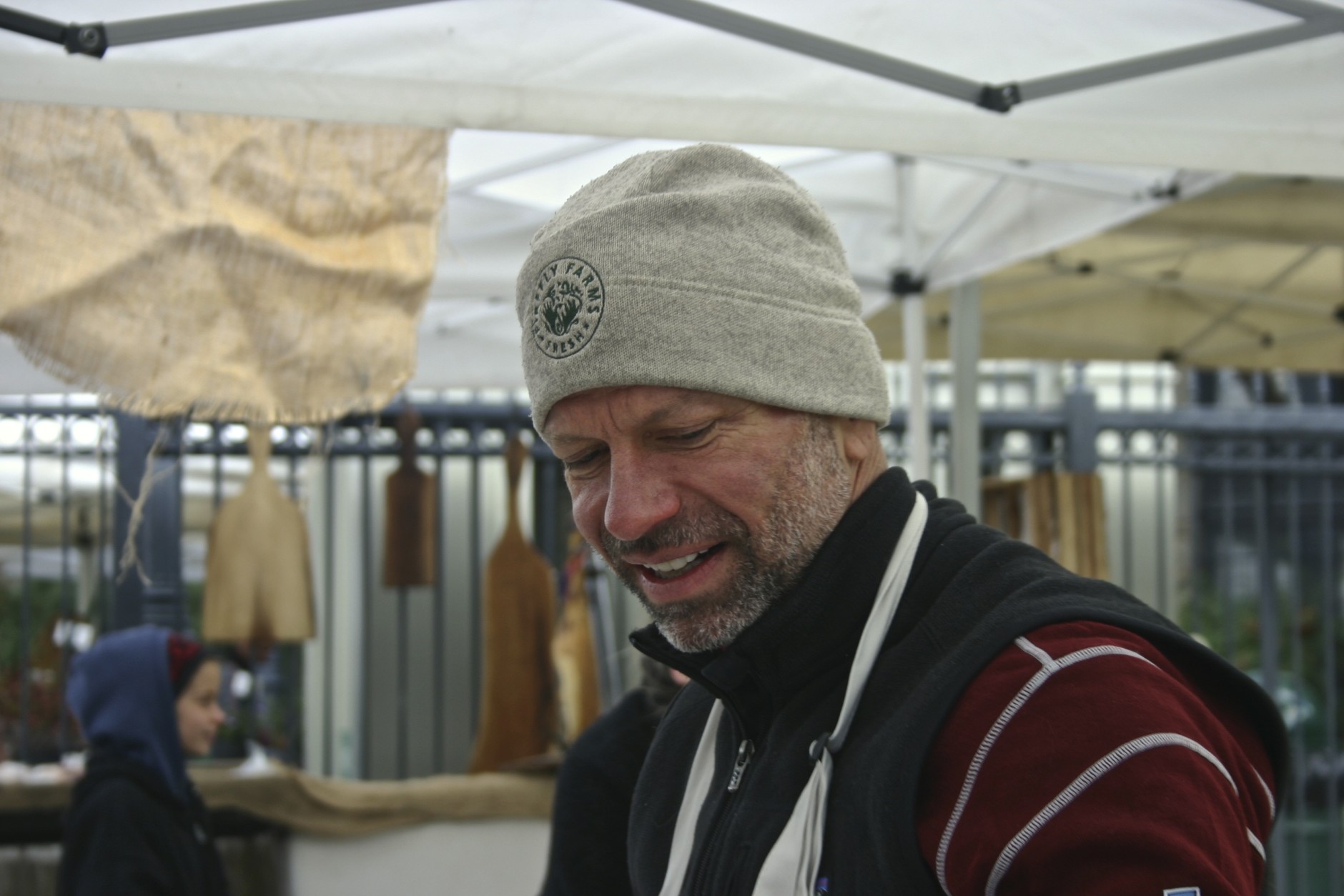 Mike Koch is now Executive Director of Fresh Farm Markets. The Dupont Circle farmer's market is year-round, so his Firefly Farms winter cap comes in handy.
 (WTOP/Kate Ryan)
