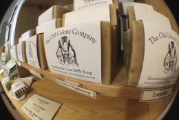 Owners of Firefly Farms, Mike Koch and Pablo Solanet, believe in promoting locally produced goods of all sorts, including these goats milk soaps from Frederick County, Maryland. (WTOP/Kate Ryan)