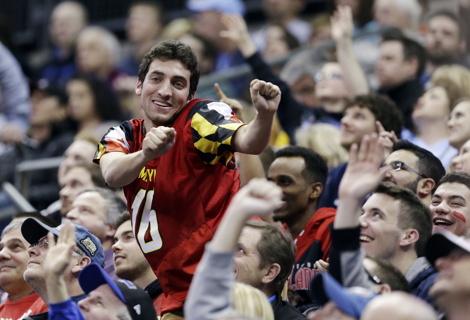 A Maryland fan dances in the crowd during the first half of an NCAA tournament college basketball game against Valparaiso in the Round of 64 in Columbus, Ohio Friday, March 20, 2015. (AP Photo/Tony Dejak)