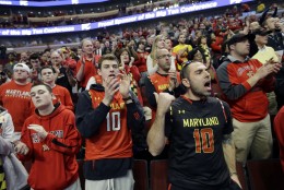 Maryland fans cheer as their team is introduced before an NCAA college basketball game against Indiana in the quarterfinals of the Big Ten Conference tournament in Chicago, Friday, March 13, 2015. (AP Photo/Michael Conroy)