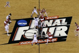 Duke's Jahlil Okafor (15) and Wisconsin's Frank Kaminsky (44) battle for the ball at the tip off during the first half of the NCAA Final Four college basketball tournament championship game Monday, April 6, 2015, in Indianapolis. (AP Photo/David J. Phillip)