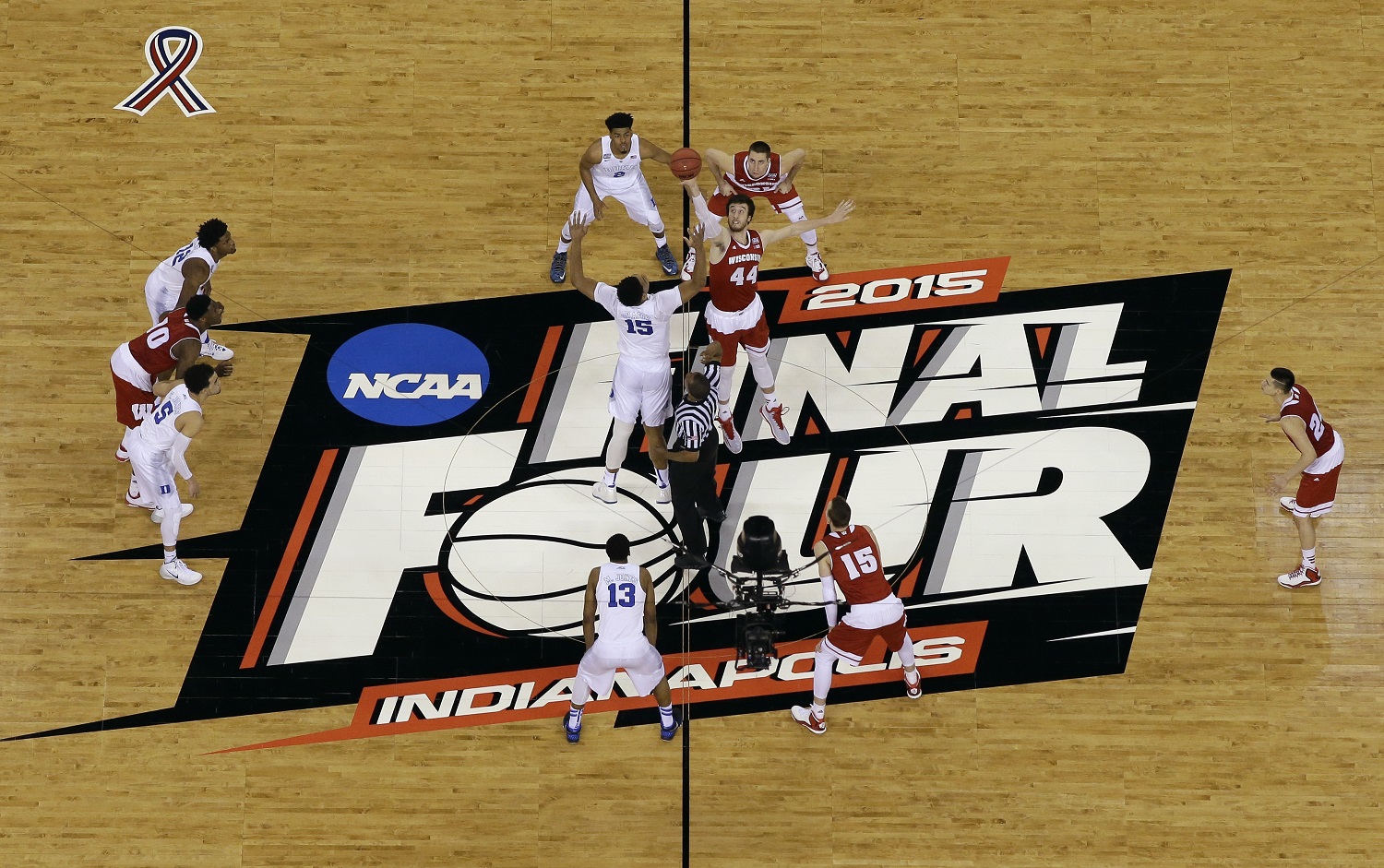 Duke's Jahlil Okafor (15) and Wisconsin's Frank Kaminsky (44) battle for the ball at the tip off during the first half of the NCAA Final Four college basketball tournament championship game Monday, April 6, 2015, in Indianapolis. (AP Photo/David J. Phillip)