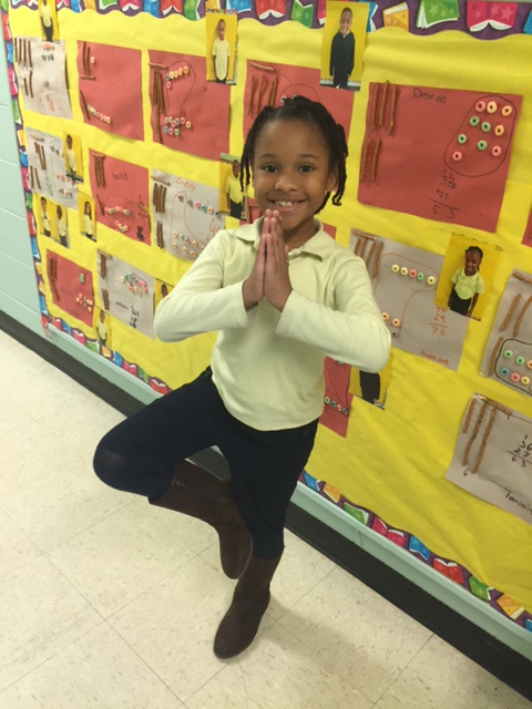 Here, Precious demonstrates her yoga skills learned through local nonprofit YoKid. (Courtesy YoKid)