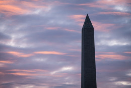 Sunrise on a cloudy day in the Nation's Capital is seen near the Washington Monument in Washington, Friday, March 14, 2014. (AP Photo/J. David Ake)