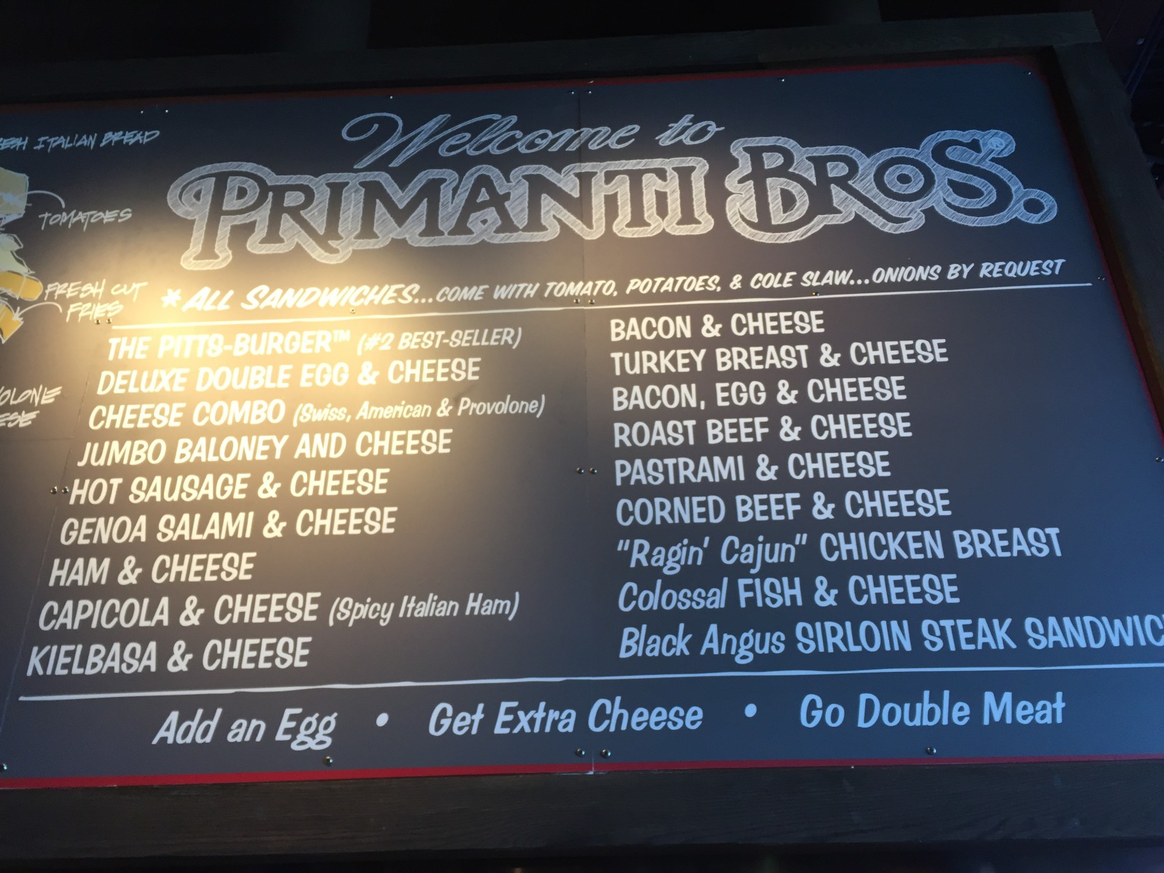 The sandwich menu at Primanti Bros. Each massive creation comes on thick Italian bread with fries, coleslaw, tomatoes and provolone cheese. (WTOP/Michelle Basch)