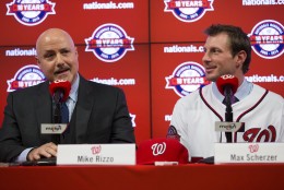 Washington Nationals pitcher Max Scherzer, right, looks on as general manager Mike Rizzo speaks during an introductory news conference at Nationals Park, on Wednesday, Jan. 21, 2015, in Washington. Scherzer signed a $210 million, seven- year contract to join the Nationals. (AP Photo/Evan Vucci)
