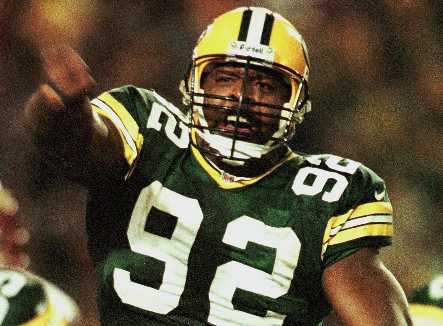 Green Bay Packers defensive end Reggie White reacts after sacking San Francisco 49ers quarterback Steve Young in the fourth quarter of the Packers 36-22 win, Sunday, Nov. 1, 1998, in Green Bay, Wis. Halfway through his farewell season and six weeks shy of his 37th birthday, White is playing like a young man again.     His 11 sacks, as many as he had all of last season, have him on pace to challenge his career-best of 21, which he set in 1987 for the Philadelphia Eagles. (AP Photo/Morry Gash)