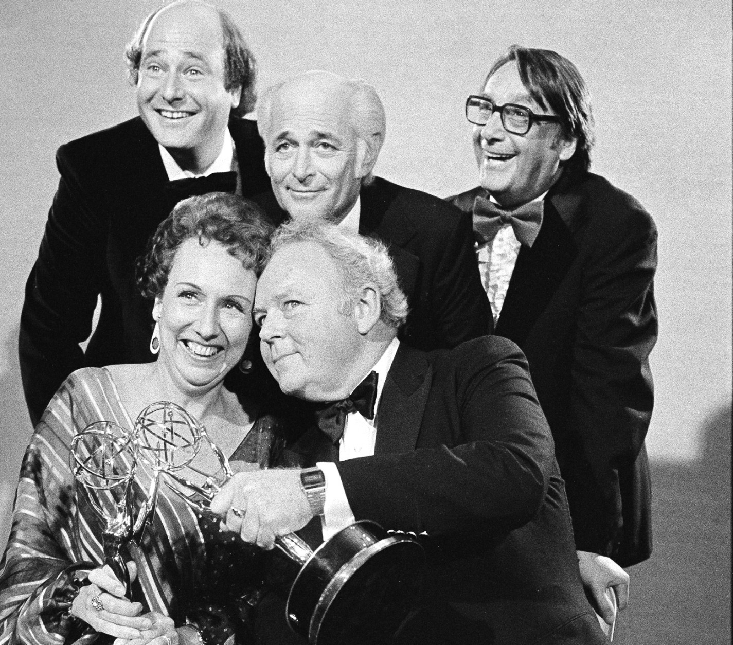 Actors Jean Stapleton, seated, left, and Carroll O'Connor, seated, right, hold their Emmys after receiving them in Hollywood, Calif., Sept. 18, 1978.  At rear, from left to right are Rob Reiner, who won an Emmy for supporting actor in the same series; Norman Lear, producer of the show; and executive producer Mort Lachman.  (AP Photo)
