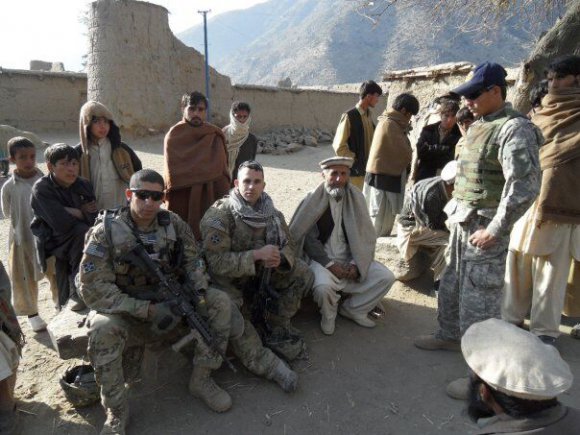 Then-2nd Lt. Florent Groberg and 1st Lt. Antonio Salinas are shown in a local Afghan village in Kunar province, Afghanistan, January 2010. (Courtesy photo)