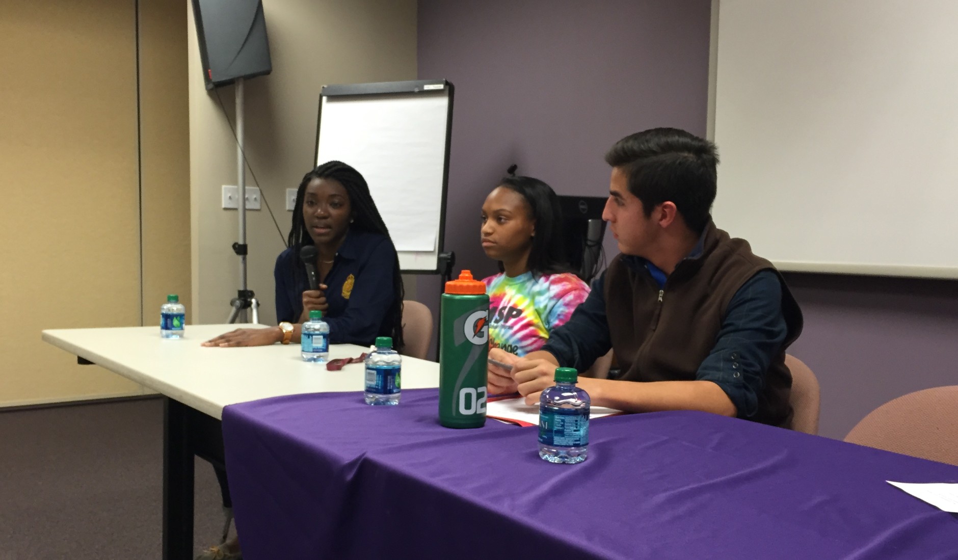 The three students on the panel were (left to right) Angie Nseliema and Aryana Jones, both seniors at Clarksburg High, and Nicolas Ballon, a senior at Walter Johnson High. (WTOP/Michelle Basch)