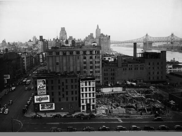 Aerial view of the area scheduled to be demolished to make way for construction of the United Nations Building, New York, New York, 1940s. The area is bounded by 42nd Street on the south, 48th Street on the north, First Avenue on the west, and Roosevelt Drive on the east. Visible at right is the Queensboro Bridge. (Photo by FPG/Getty Images)